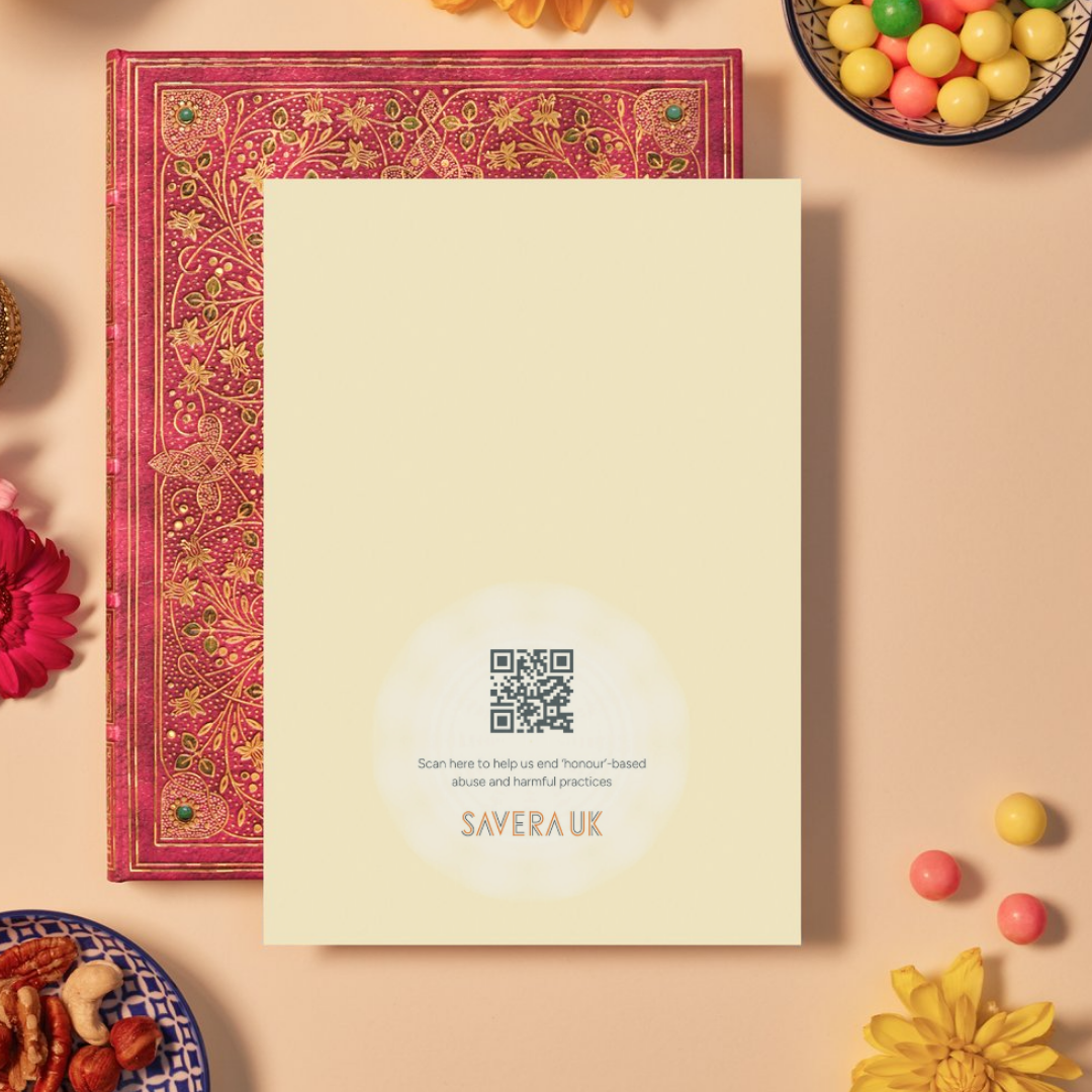 Back of a card with a soft yellow background featuring a faint circular mandala pattern radiating from the bottom center. In the middle of the mandala is a QR code above the text: ‘Scan here to help us end ‘honour’-based abuse and harmful practices.’ Below the text is the orange geometric logo ‘SAVERA UK.'