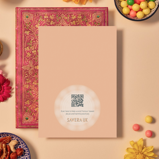 Back of a card with a warm peach background featuring a subtle circular mandala pattern radiating from the bottom center. In the center of the mandala is a QR code above the text: ‘Scan here to help us end ‘honour’-based abuse and harmful practices.’ Below the text is the orange geometric logo ‘SAVERA UK.’