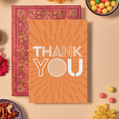 Card with bold white text reading ‘THANK YOU’ in a mix of outlined and striped geometric fonts. The background is a bright orange featuring a mandala-like burst pattern made of radiating rectangular shapes, creating a dynamic and energetic sense of gratitude and appreciation.